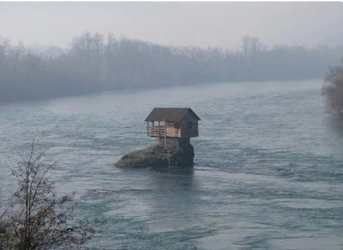 Secluded riverside house on rock