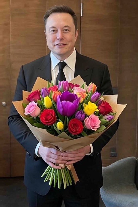 Elon Musk holding flowers Elon Musk holding flowers