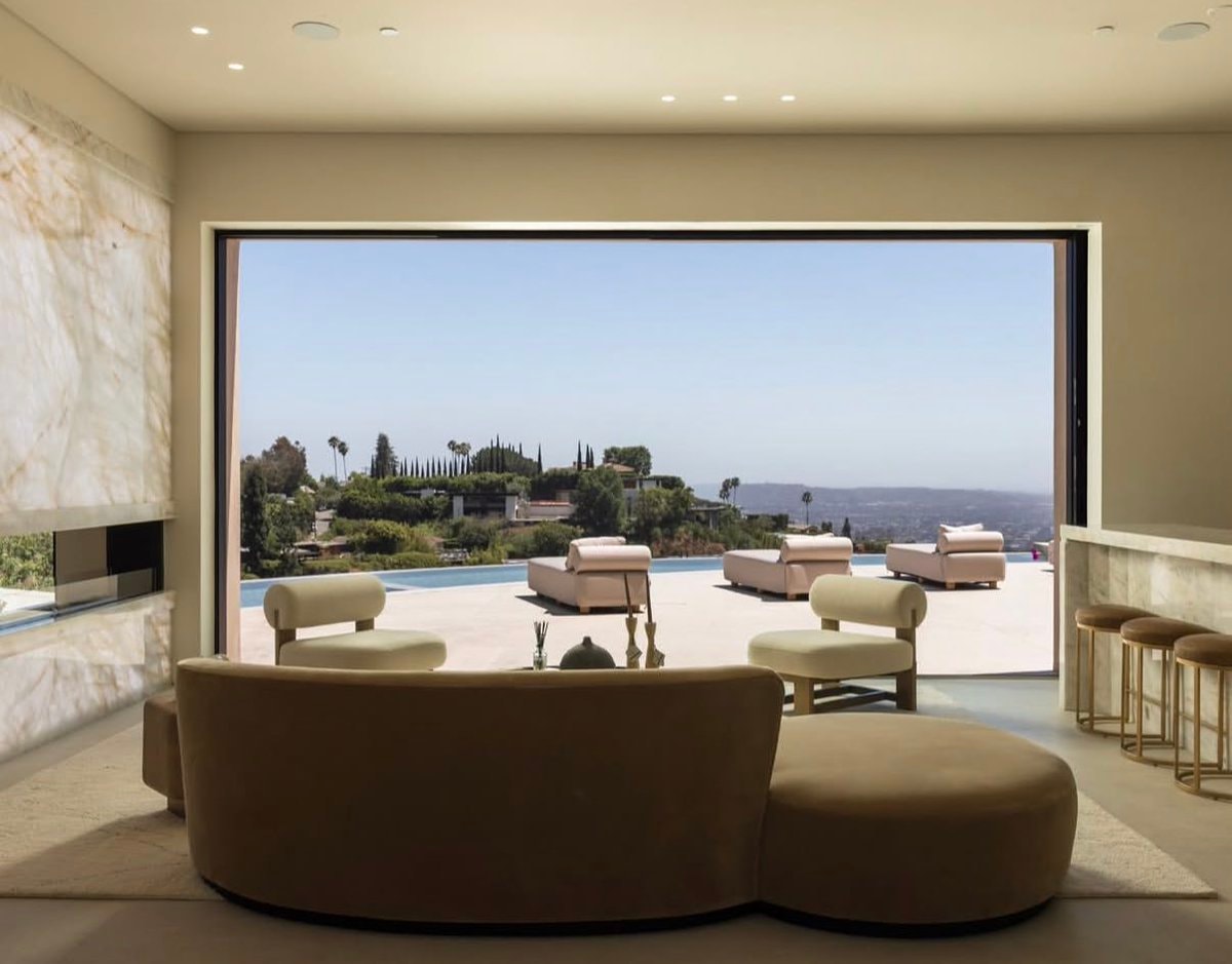 Modern infinity pool mansion at dusk (photo 2 of 4)