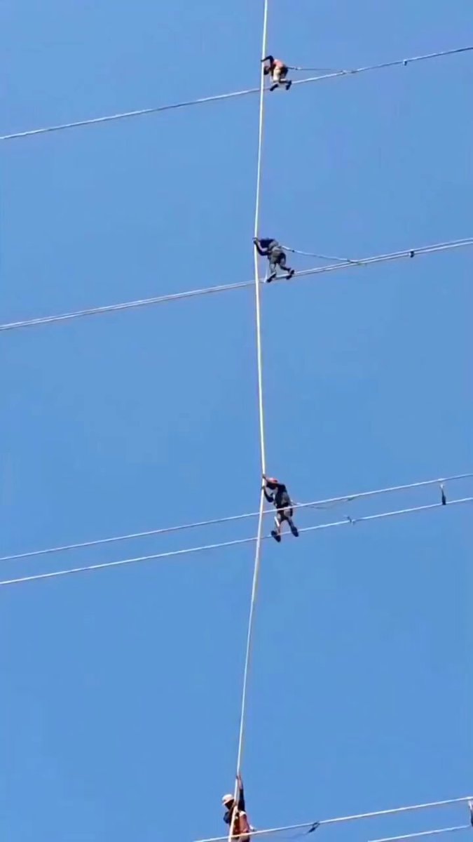 power line worker climbing lines