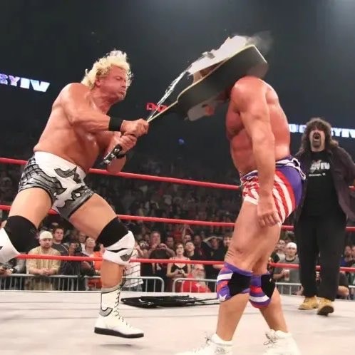 Jeff Jarrett guitar shot splinters Kurt Angle