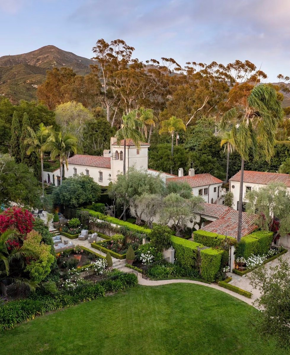 Ivy-covered estate at twilight (photo 3 of 4)
