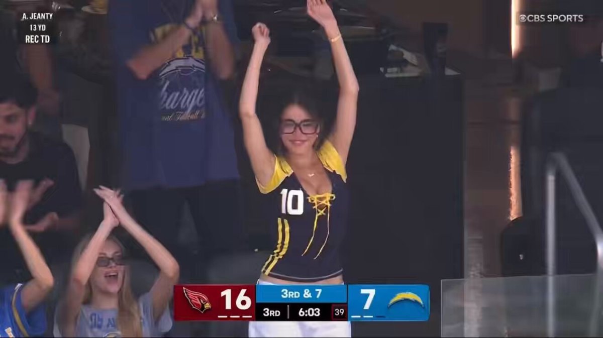 Madison Beer cheers for Justin Herbert
