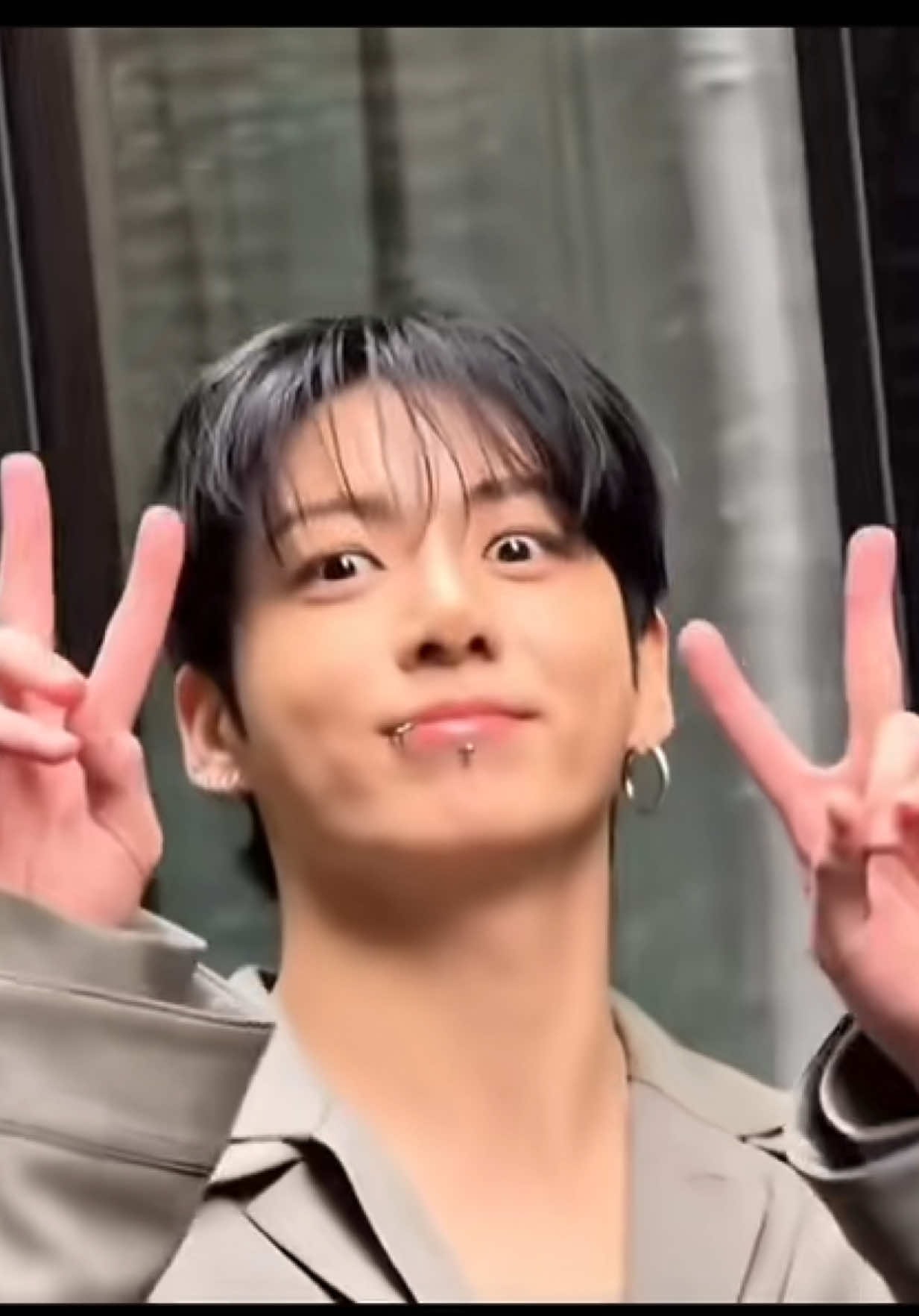 young man peace signs