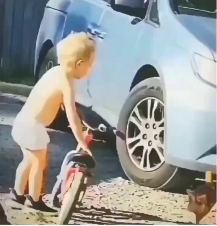 Toddler attempting impossible task
