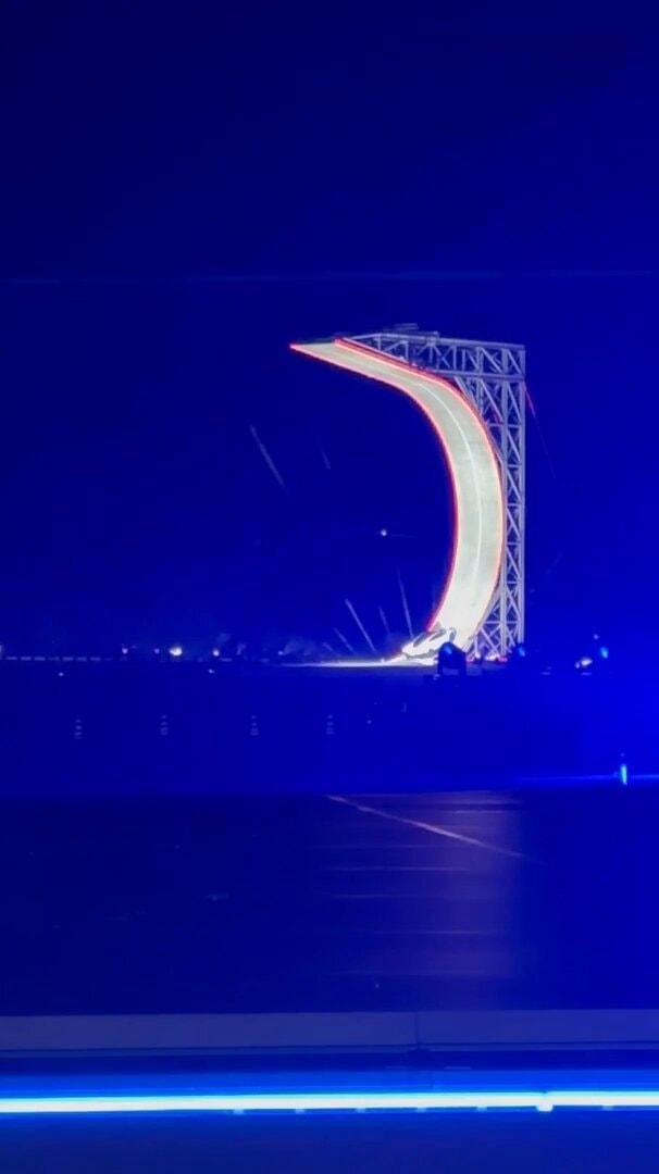 car stunt on curved ramp