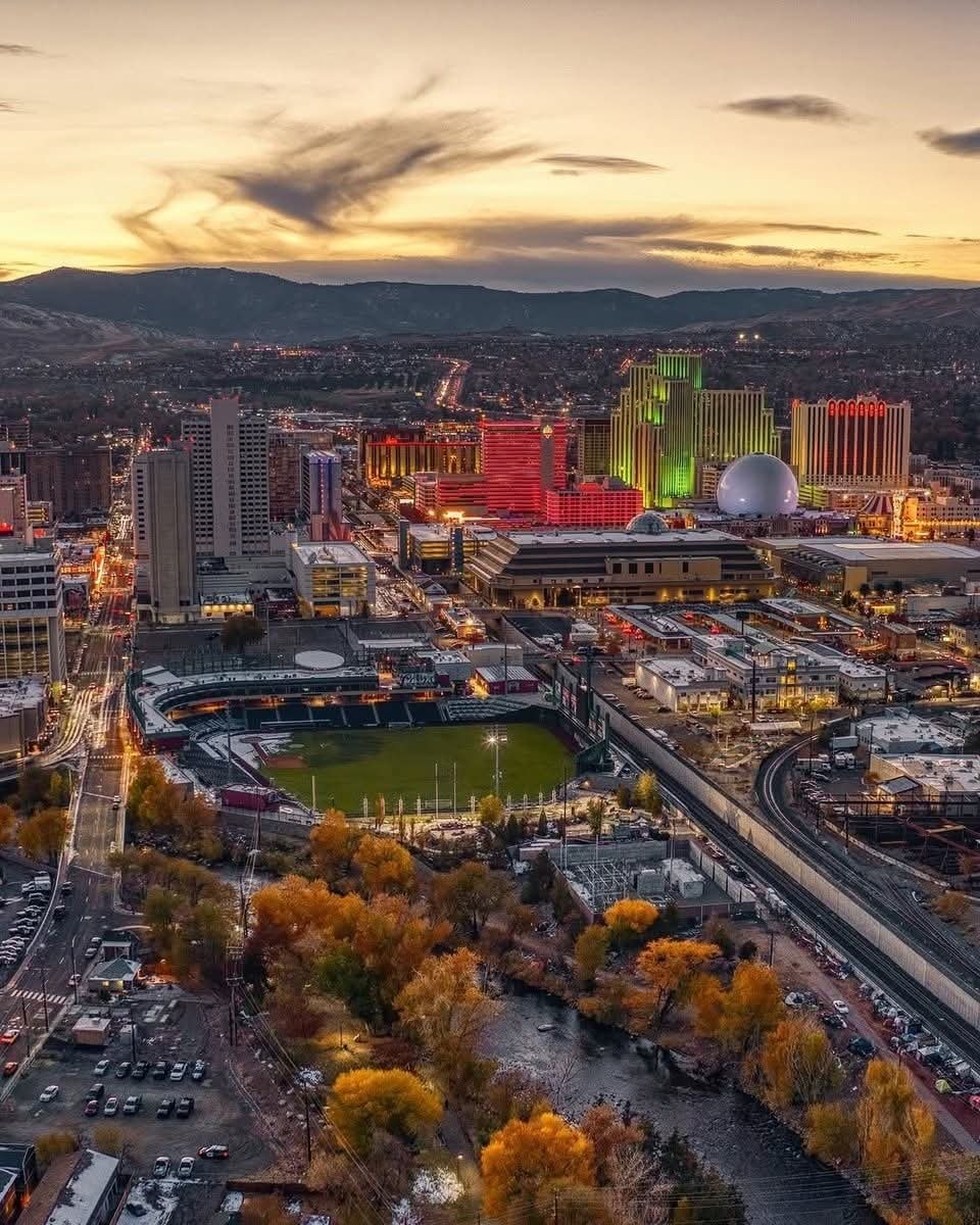 City skyline at dusk with stadium