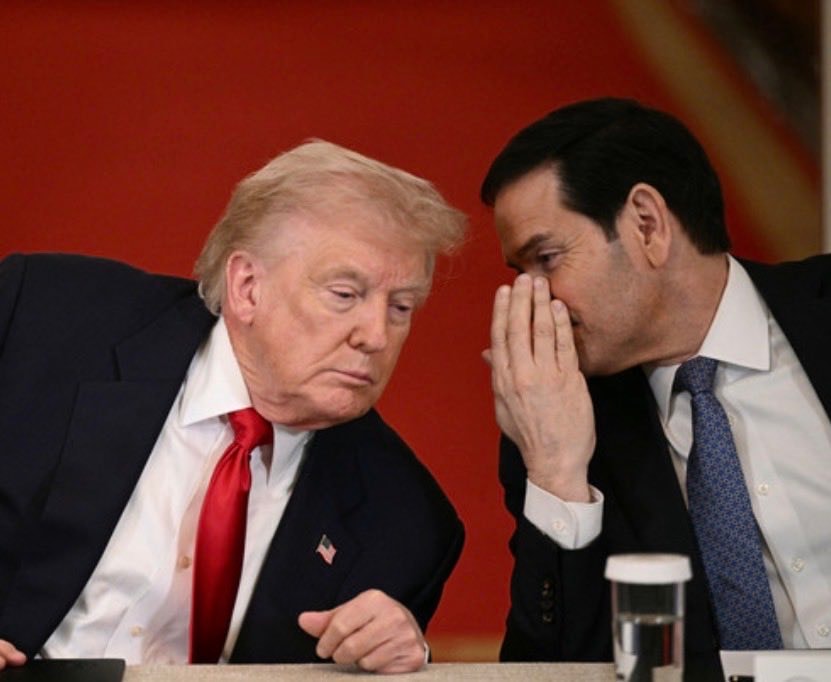 Donald Trump and another man whispering Donald Trump and another man whispering