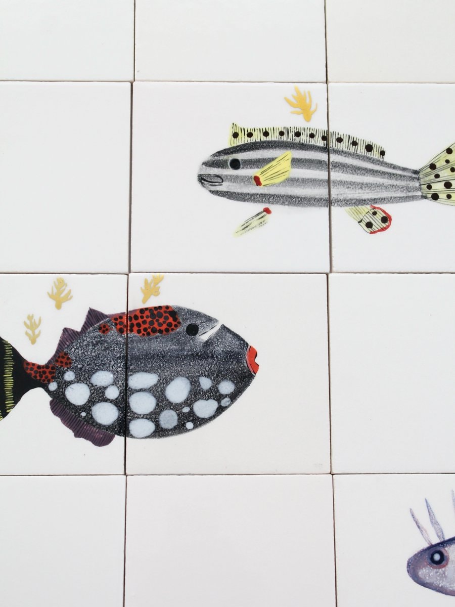 bathroom scene with fish decals (photo 2 of 4)