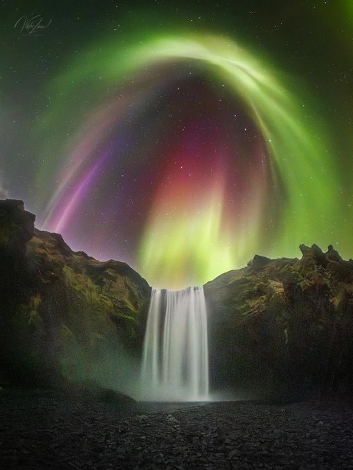 Aurora over Skógafoss Iceland