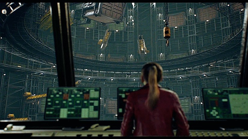 woman in red jacket looking out chamber