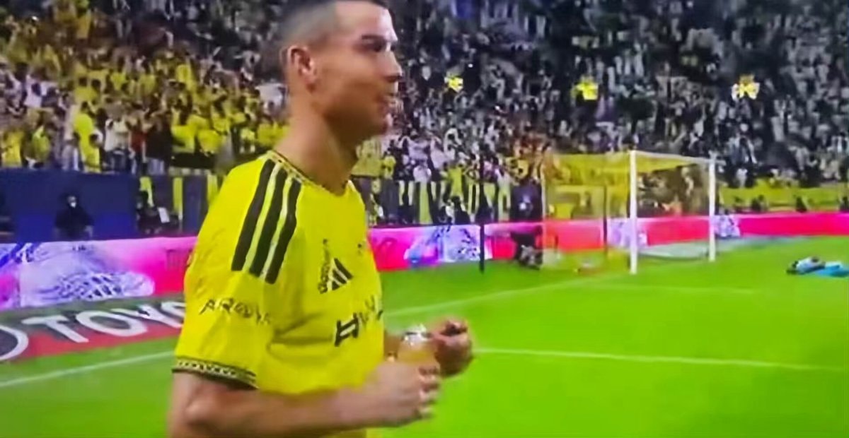 soccer player in yellow jersey