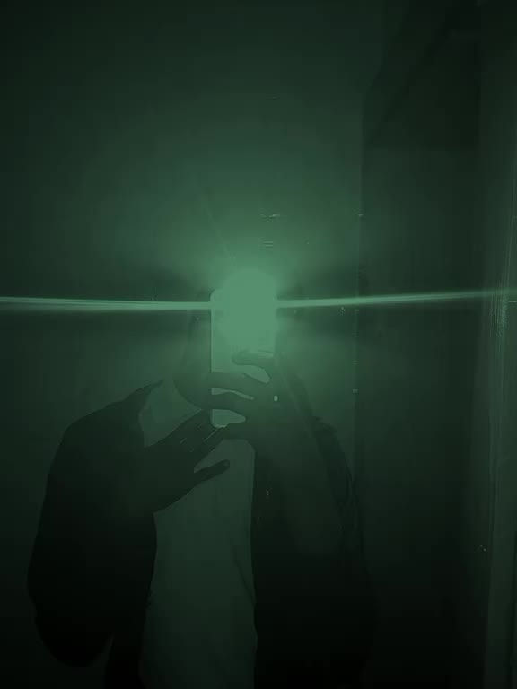 mirror selfie with green tint