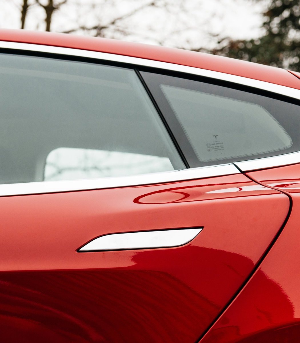 Tesla logo on light blue car (photo 2 of 2)