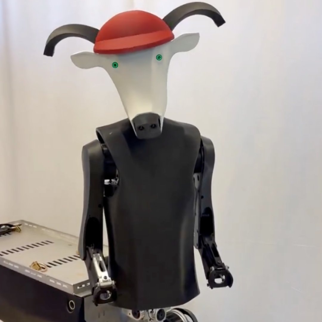 robot with cow head and red cap