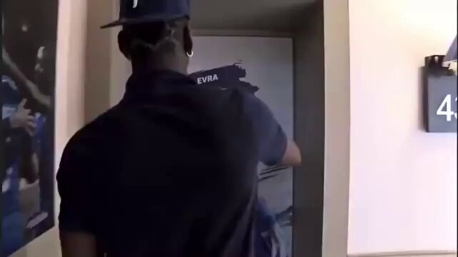 man in dark blue shirt and cap
