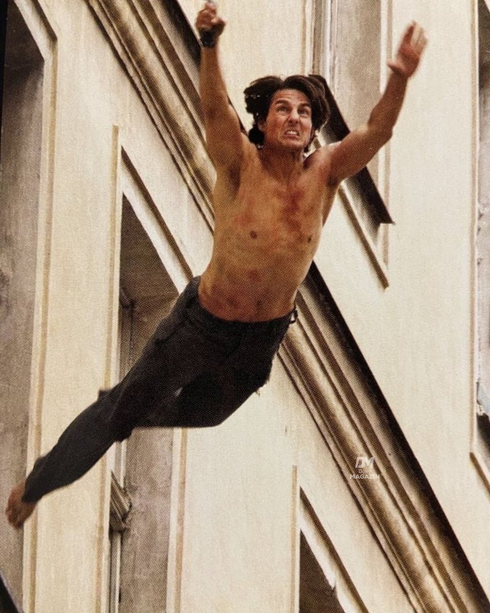 Tom Cruise hanging from wires (photo 2 of 2)