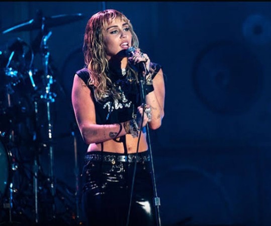 Miley Cyrus performing on stage