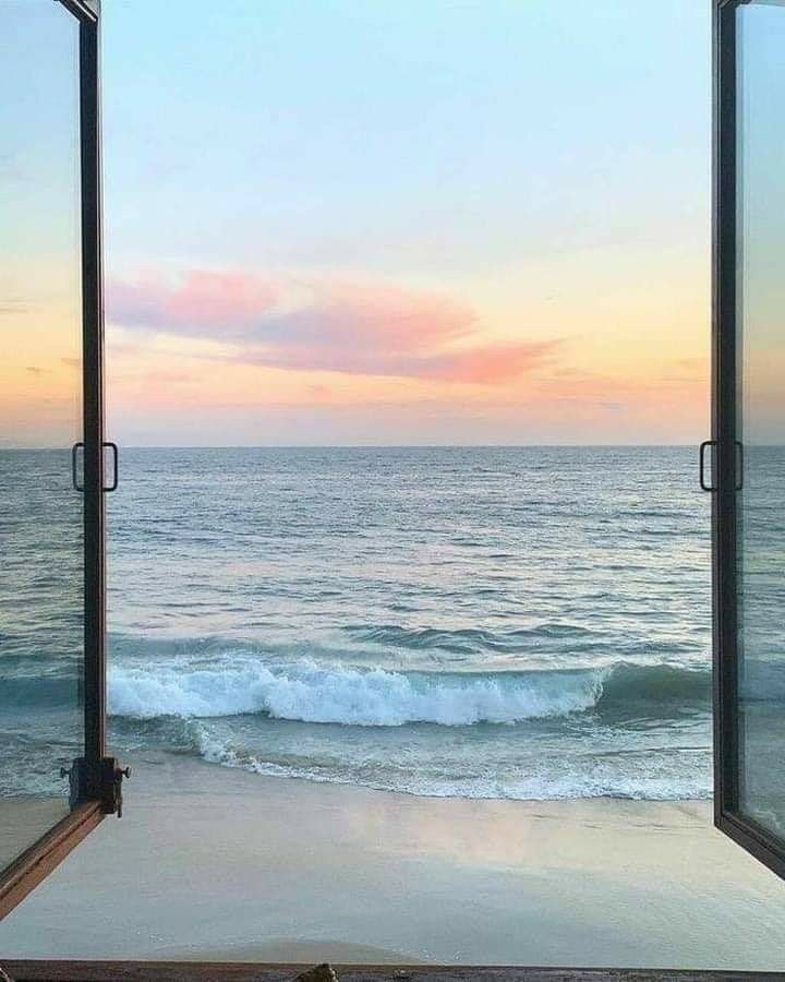ocean view through window at sunset