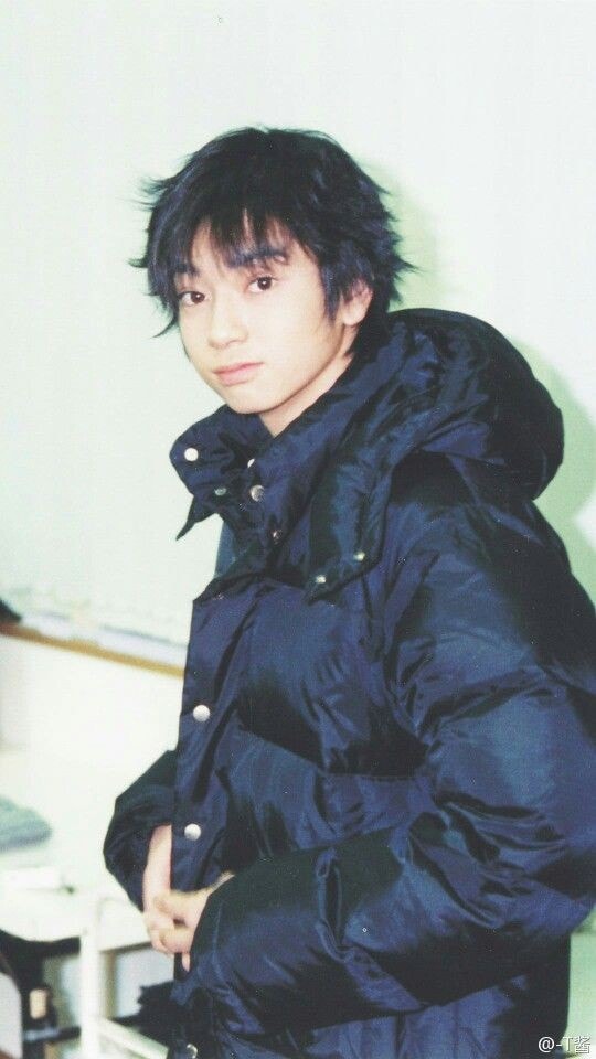 young person in dark puffer jacket