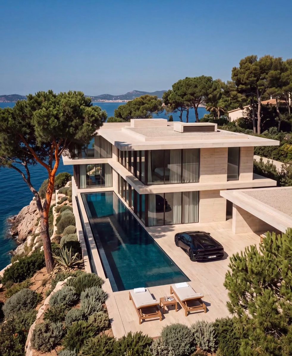 cliffside villa with black sports car