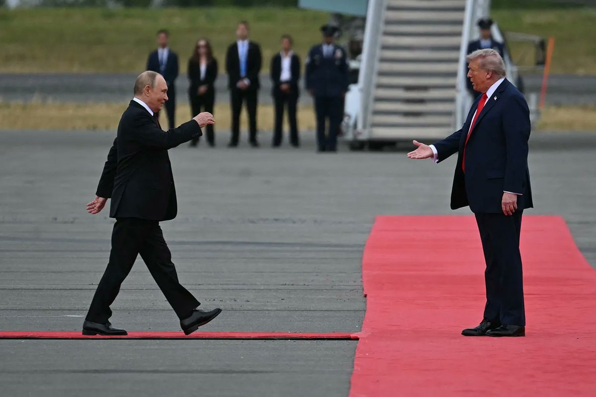 Putin and Trump meet on tarmac Putin and Trump meet on tarmac