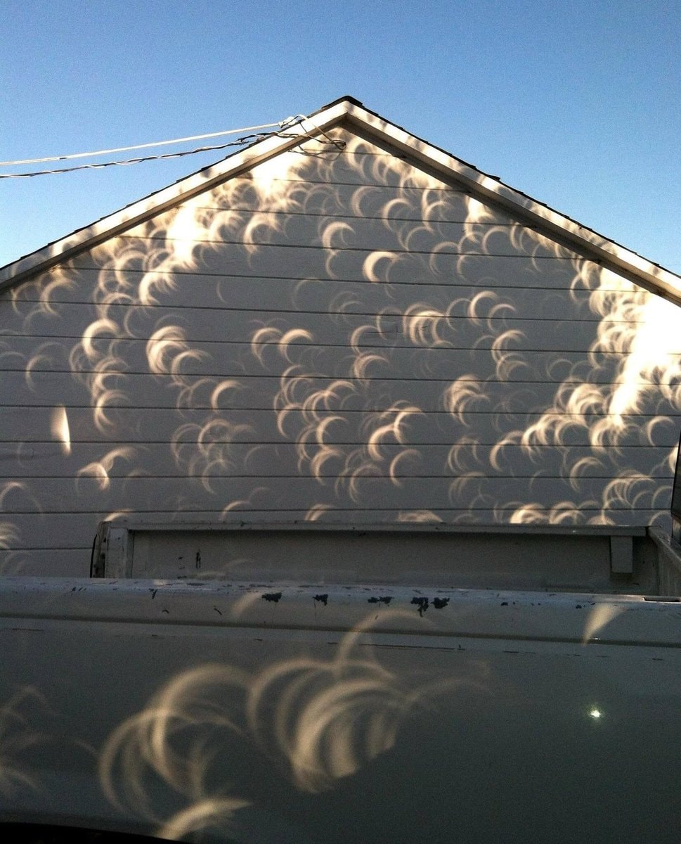eclipse shadows on house wall (photo 3 of 4)