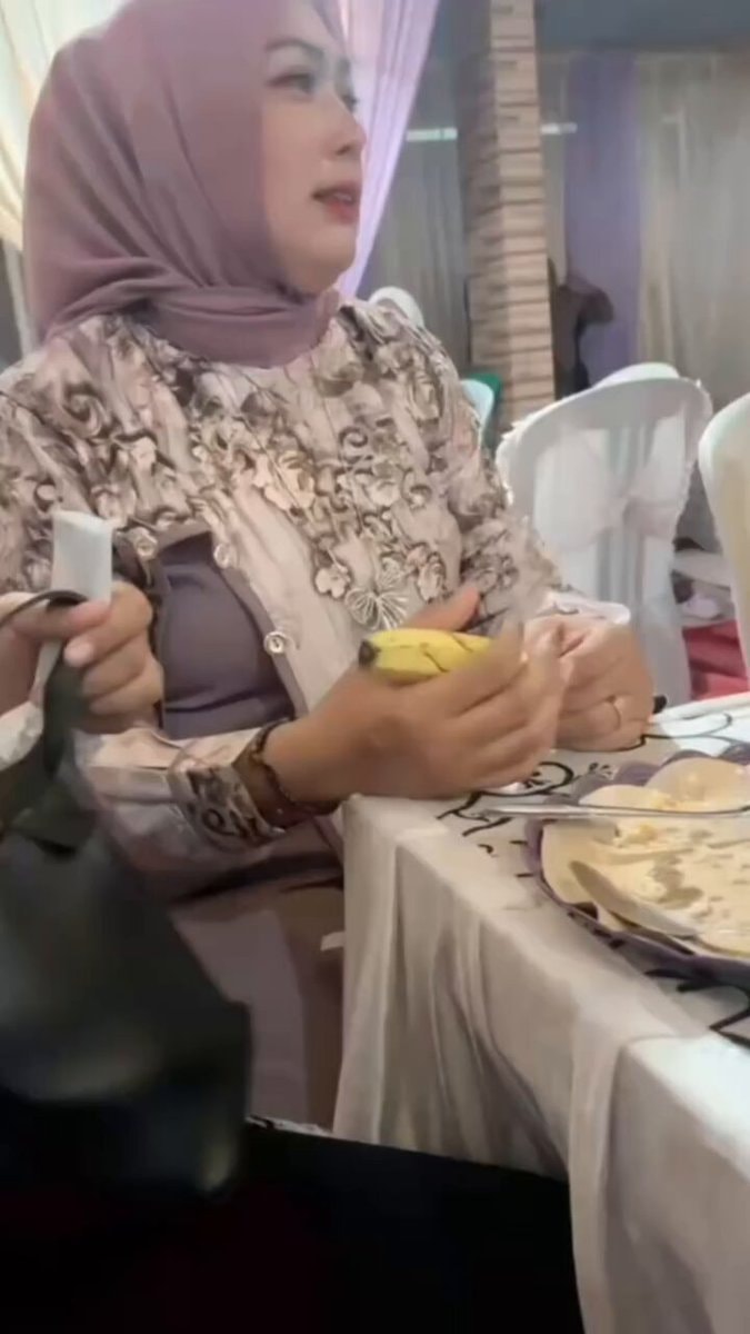woman in hijab and patterned jacket