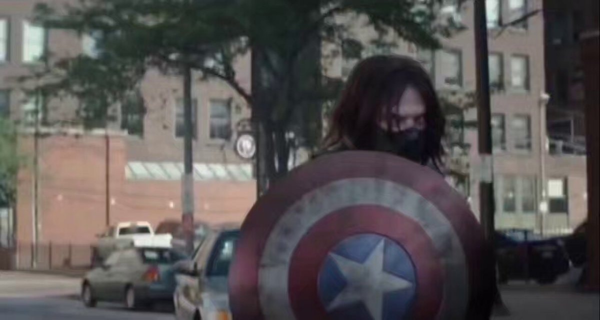 Winter Soldier holds Captain America shield