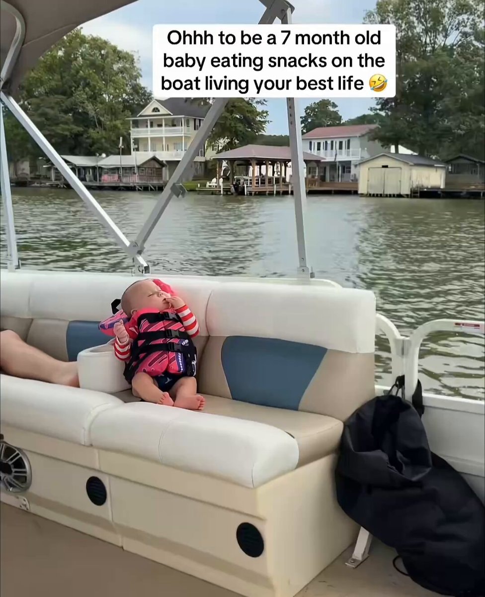 Baby eating snacks on boat