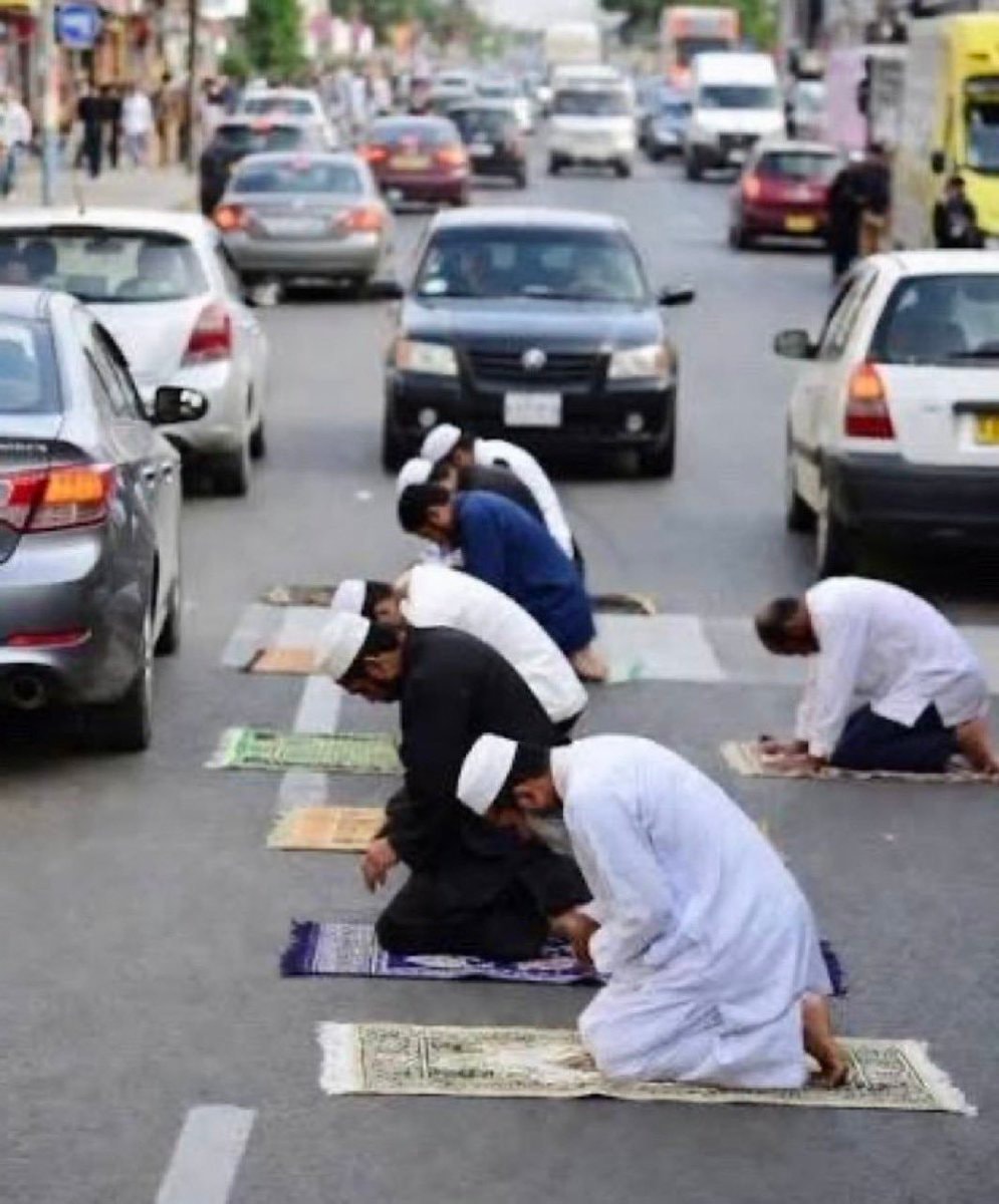 Muslims praying in the street
