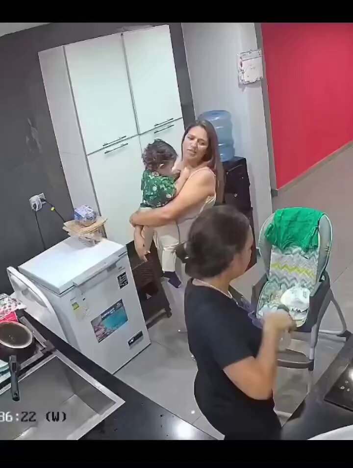 exhausted mom gives bottle to friend