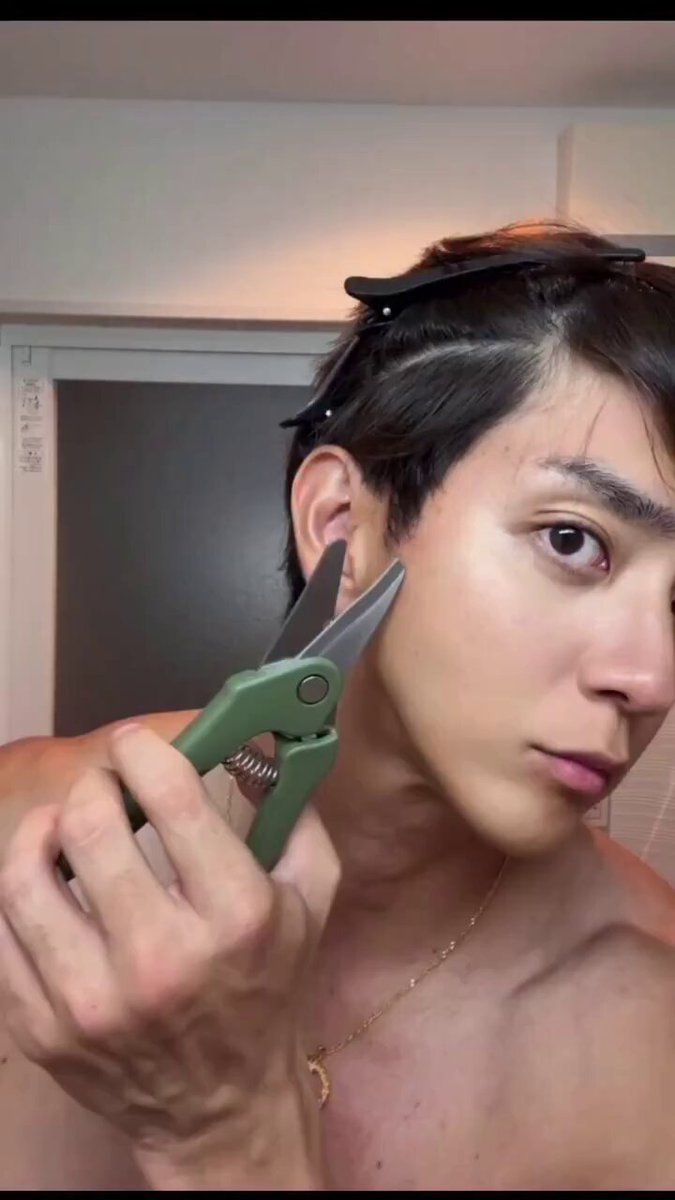 DIY haircut with green scissors