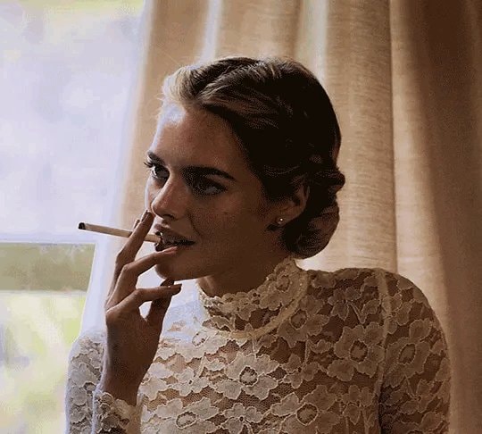 woman in white lace smoking