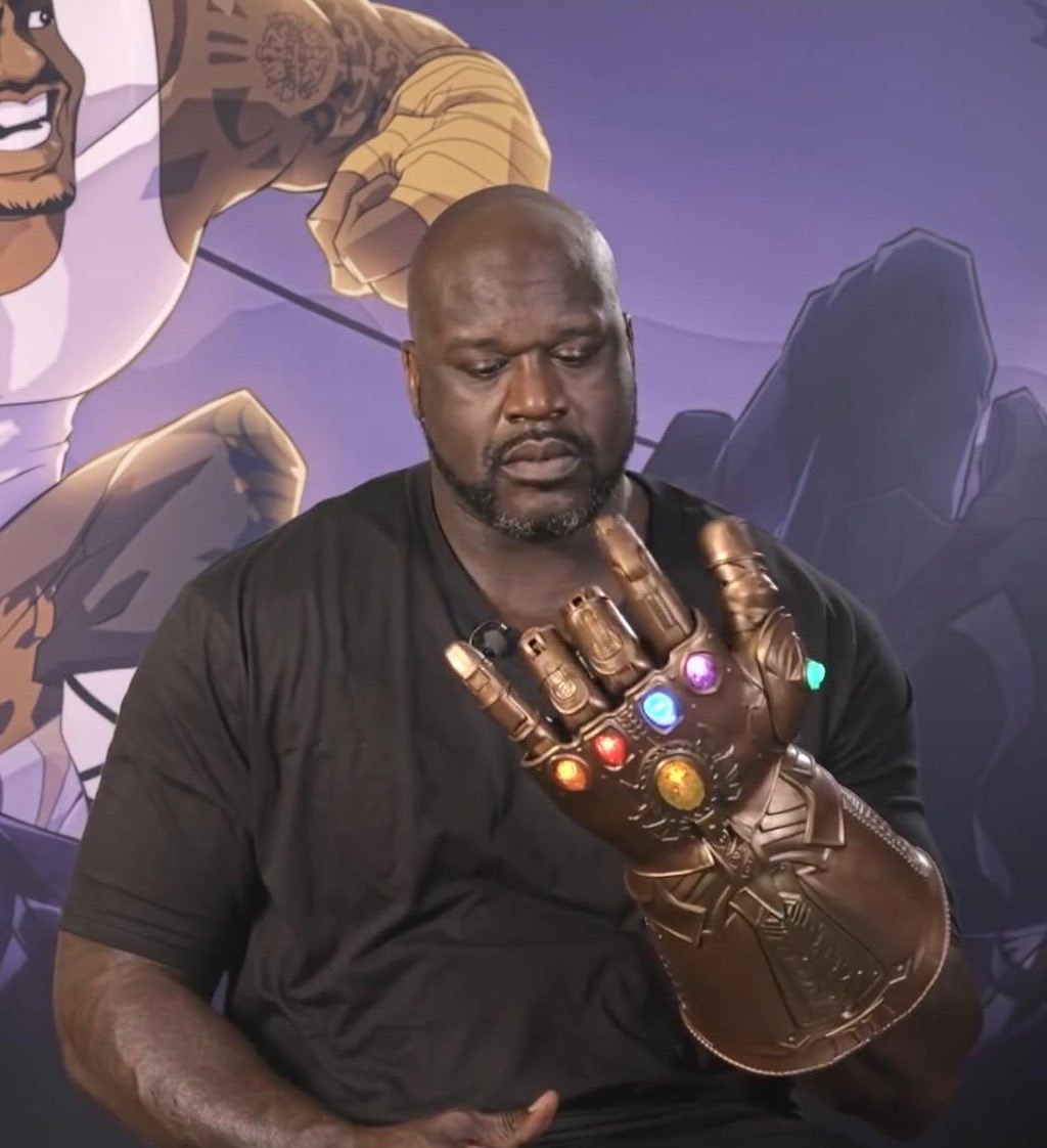 Shaq holding Infinity Gauntlet (photo 1 of 2)