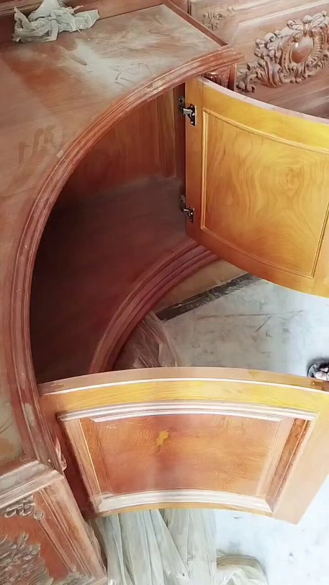 curved unfinished wooden cabinet