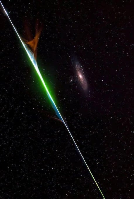 cosmic green light beam starry sky