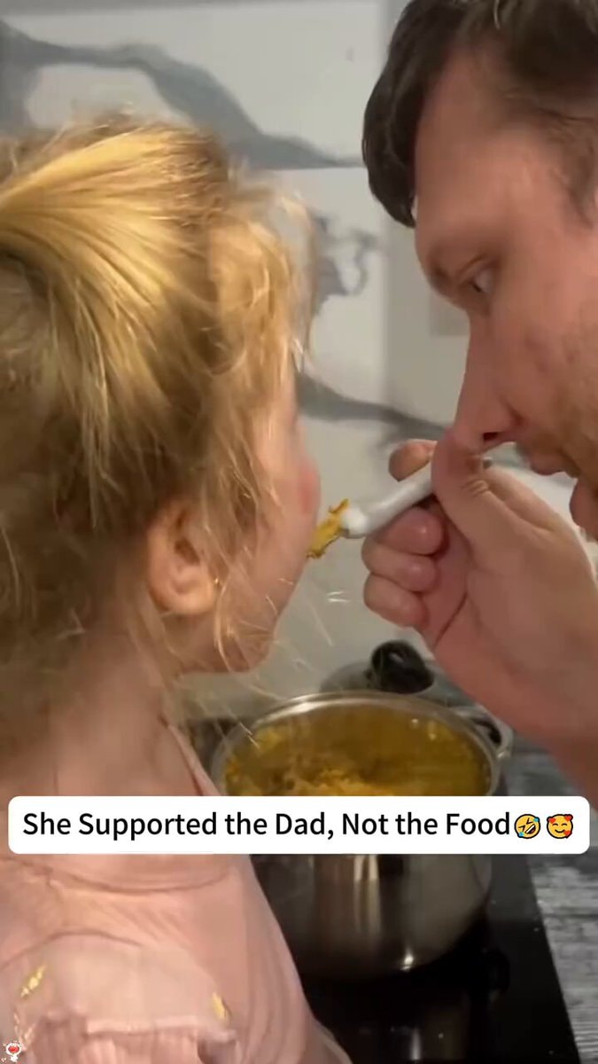 Dad feeding daughter joy