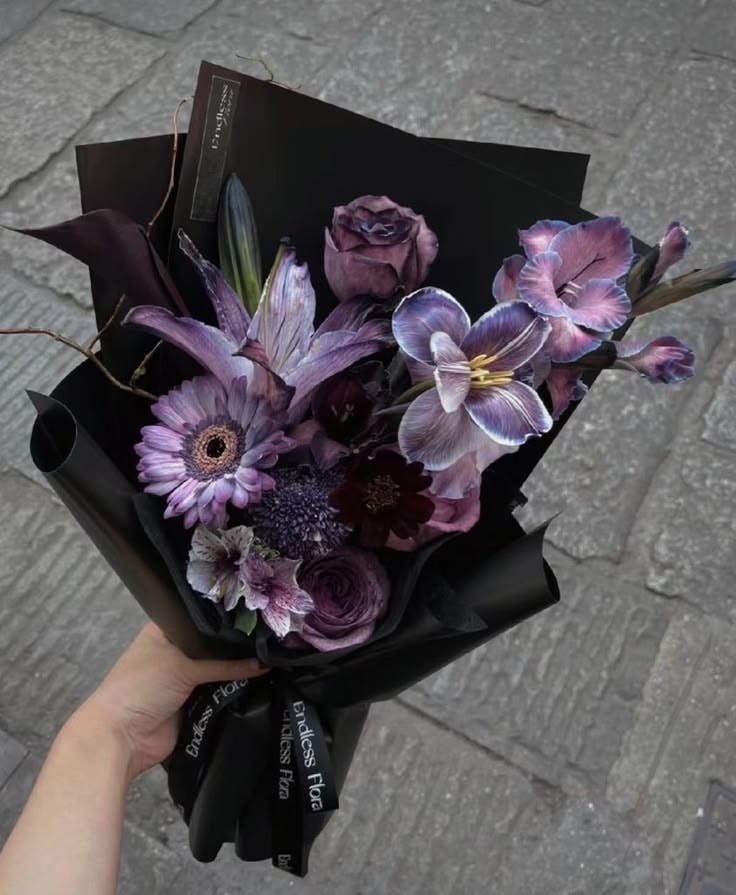 dark flower bouquet with purple lilies (photo 2 of 3)