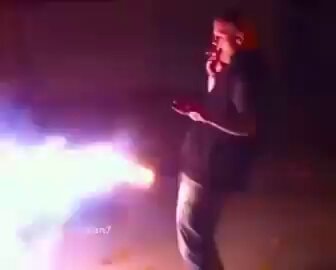 young man smoking with colorful light burst