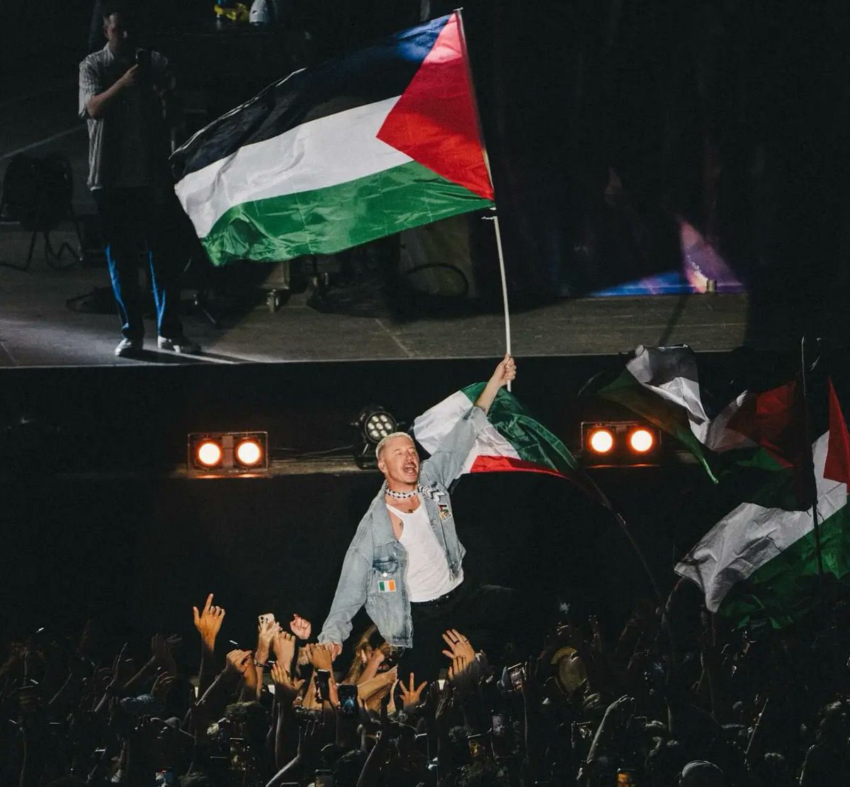 Macklemore stage moment with flag