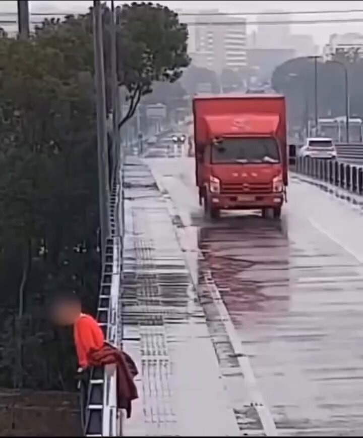 red truck driving in rain