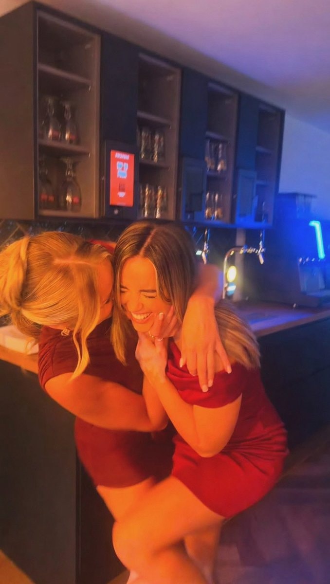 Georgia May Foote with cousin in red dresses