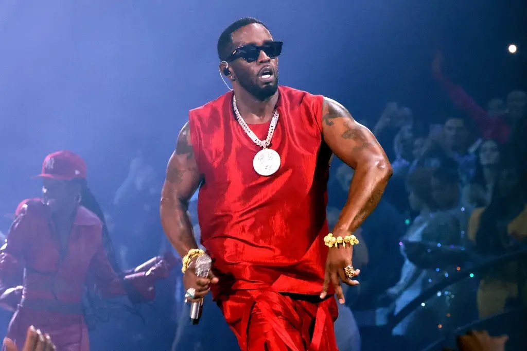 Diddy performing in red at Fort Dix