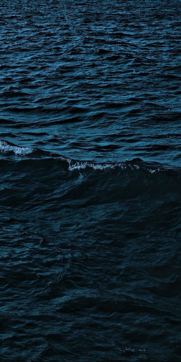 Lone sailboat lost in blue (photo 2 of 3)