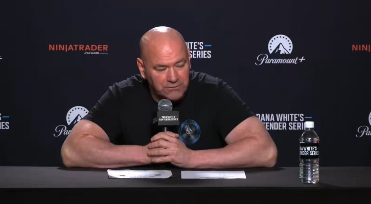 Dana White seated at a table