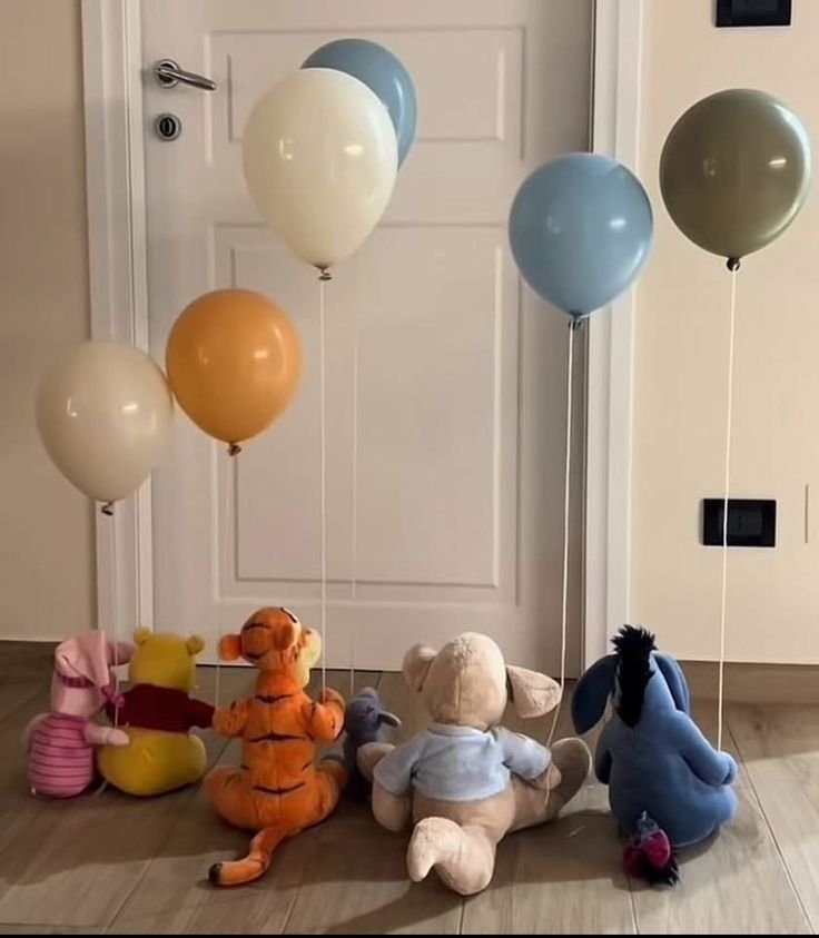 Winnie the Pooh characters with balloons