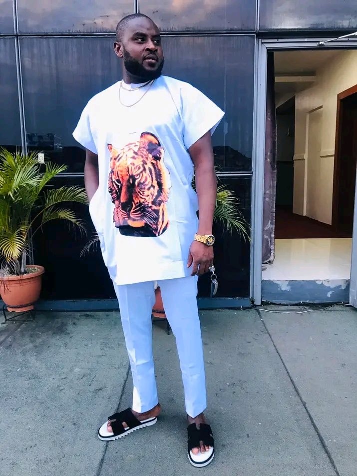 Man in white tiger tunic