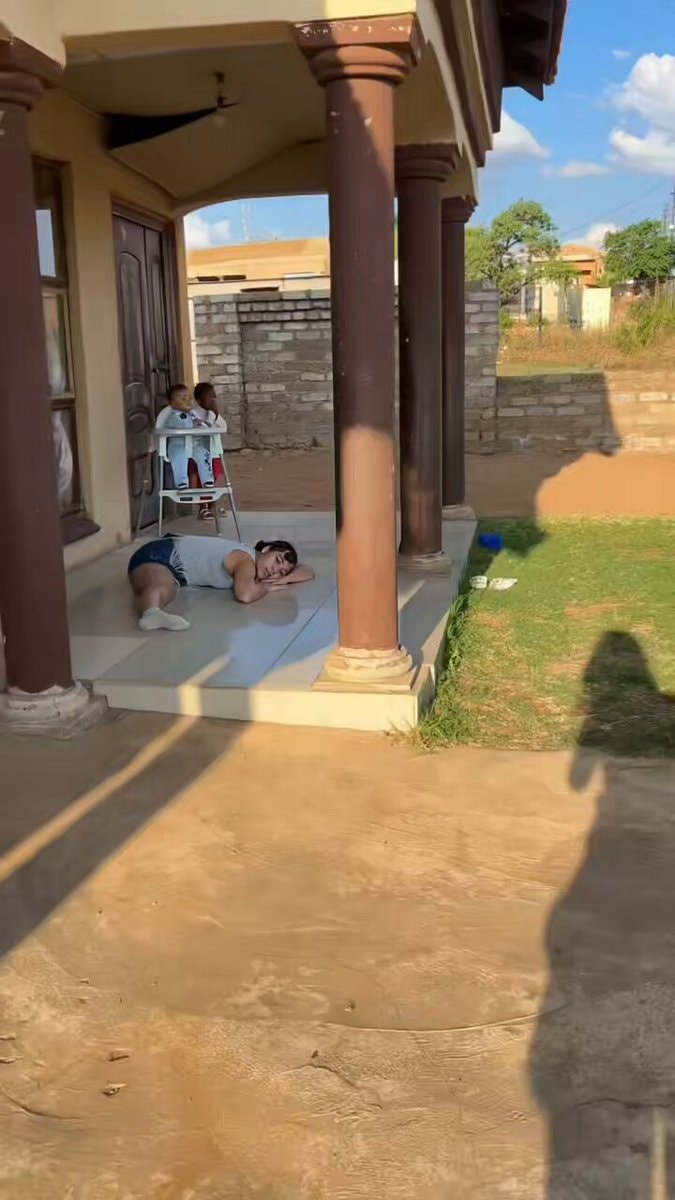 Woman resting on tiled porch