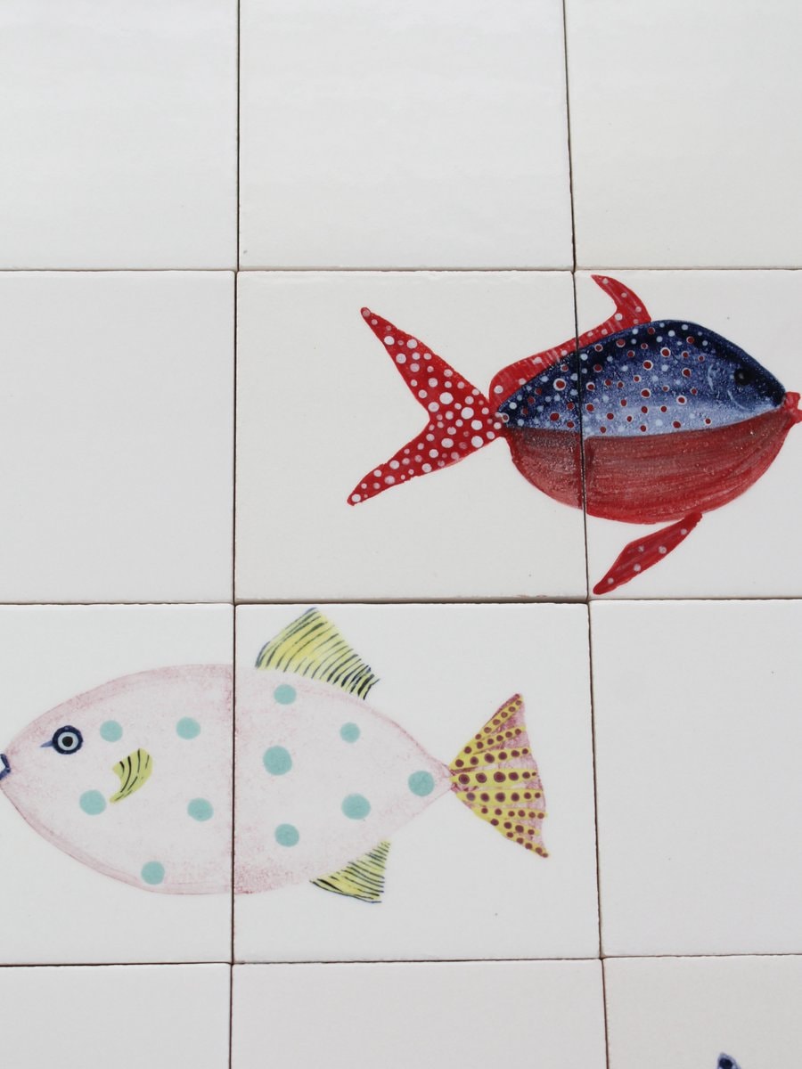 bathroom scene with fish decals (photo 4 of 4)